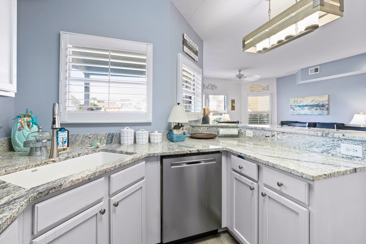 Your spacious kitchen features granite countertops, stainless steel appliances, and coastal touches that make meal prep feel like a breeze.