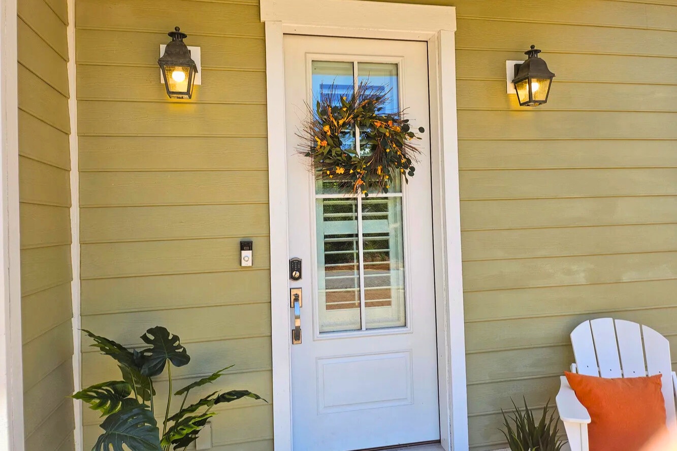 A warm coastal welcome greets you at this 30A retreat, where soft hues, crisp trim, and lush greenery set the tone for a relaxing Santa Rosa Beach escape.