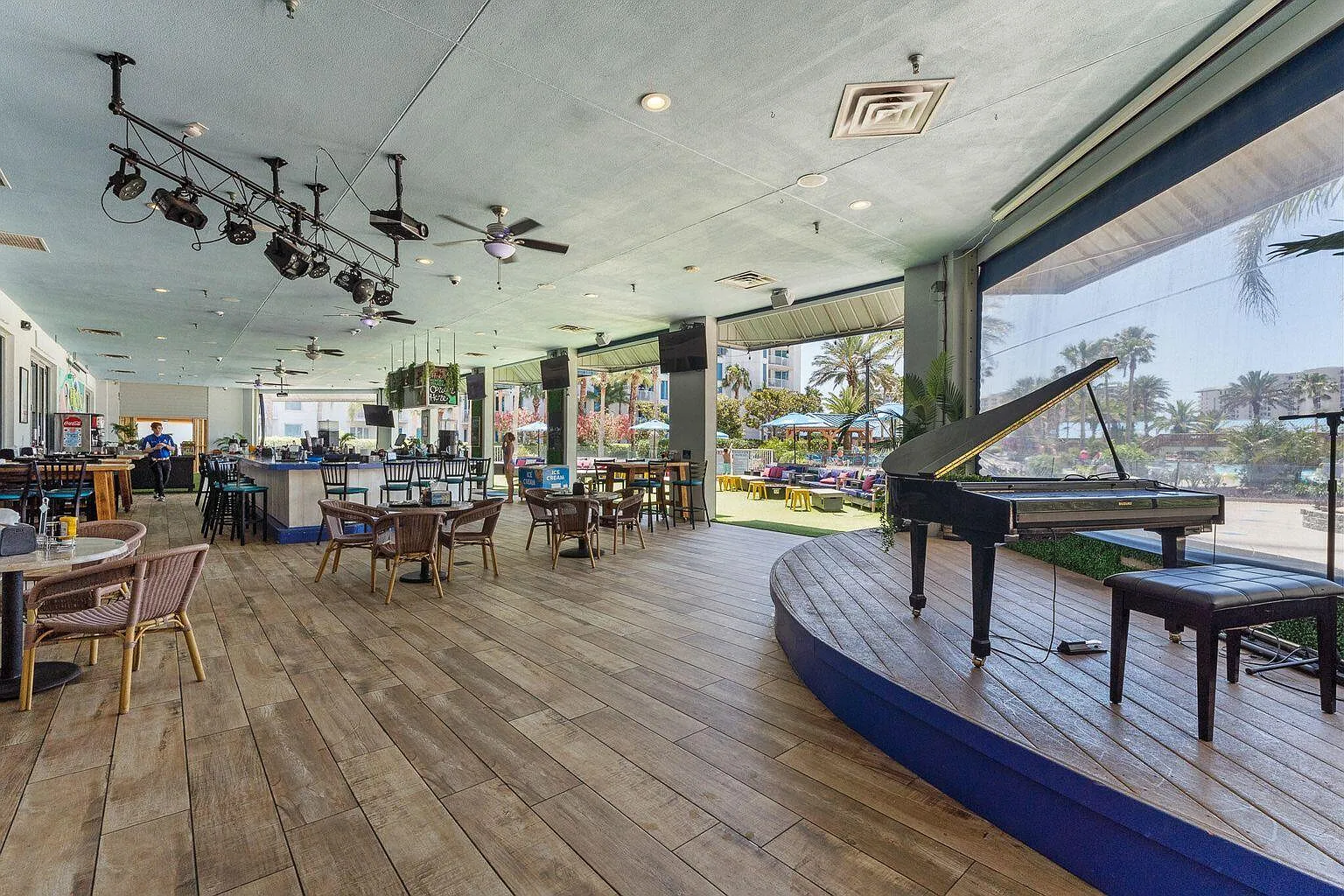 Unwind in this elegant restaurant with a grand piano, where tropical breezes flow through open walls connecting you to paradise outside.