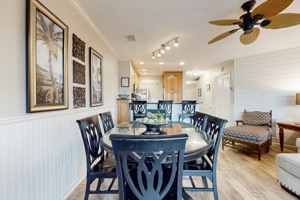 Tropical-inspired décor and open-concept kitchen just steps away for easy hosting.