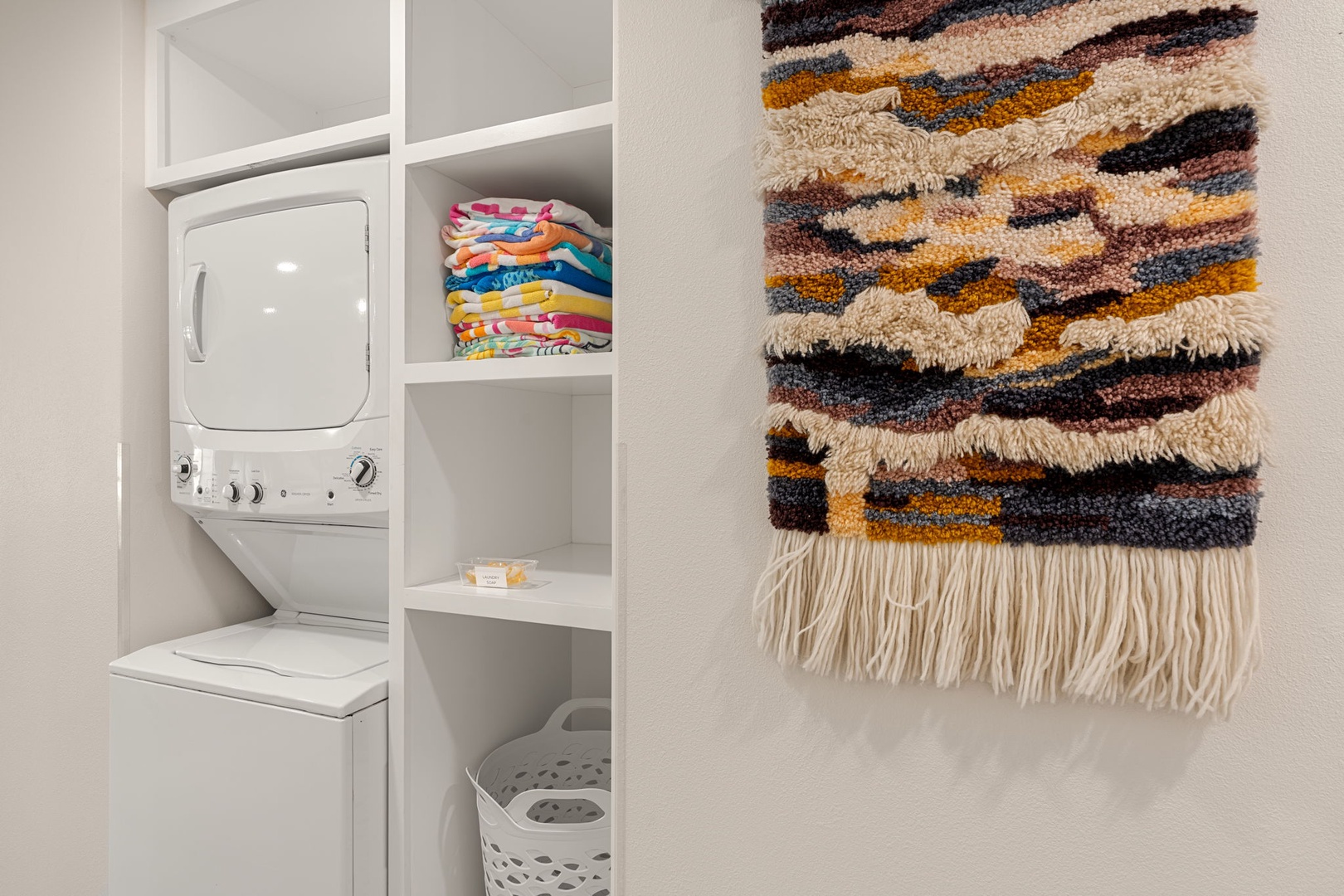 In-unit washer and dryer with convenient storage.