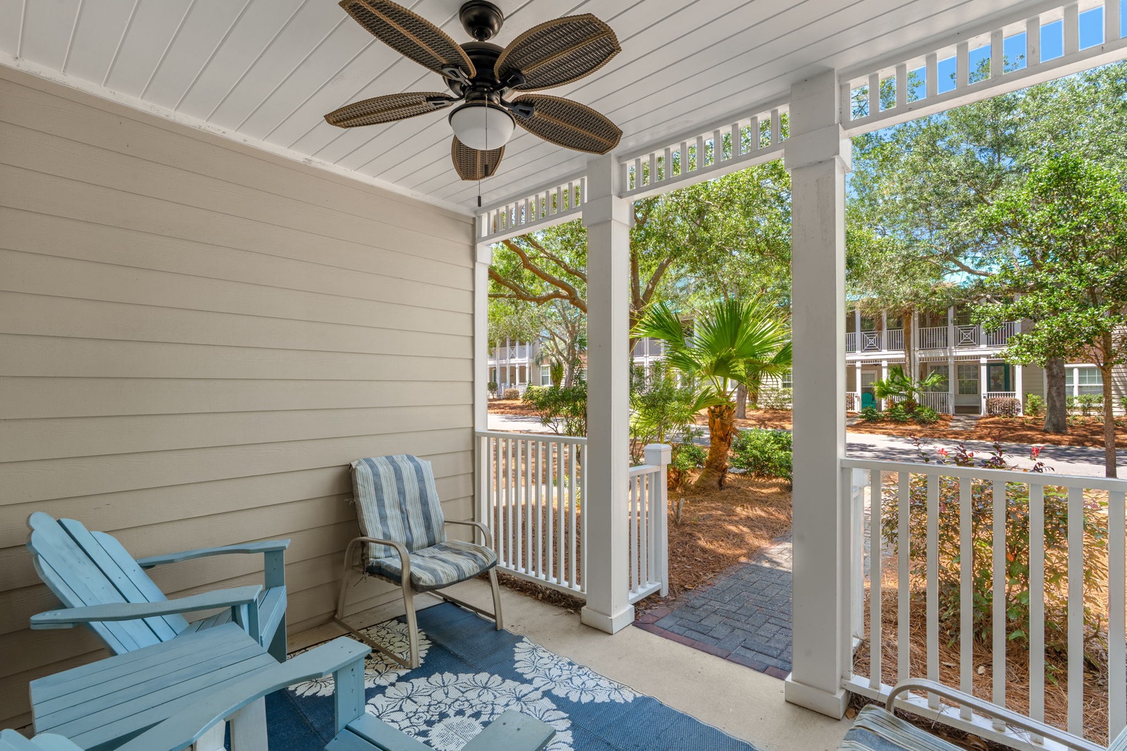 Relax on your private porch with coastal breezes and views of lush greenery and neighboring buildings. The perfect spot to unwind with your morning coffee or evening read.