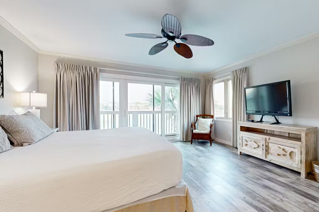 Wake up in this breezy coastal bedroom where soft linens and beach-inspired décor invite your complete relaxation.  Enjoy a private balcony.