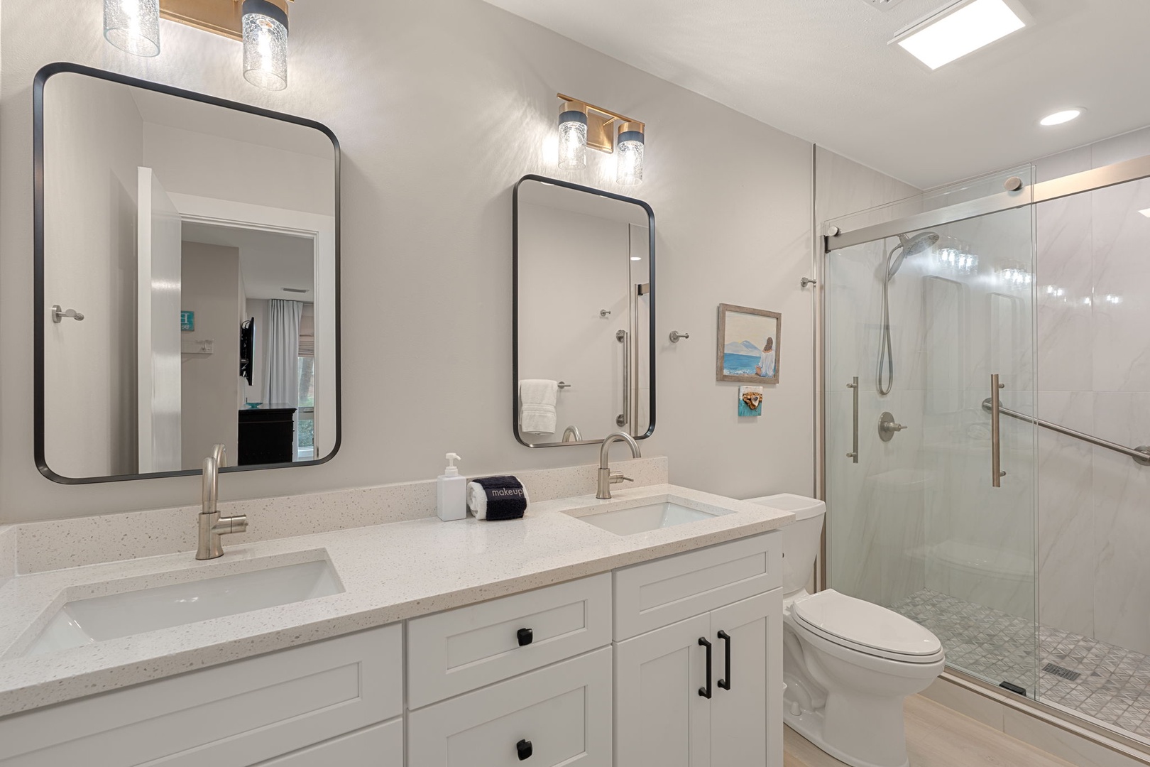 Step into your spa-like bathroom featuring dual vanities, rainfall shower, and modern fixtures for ultimate relaxation.