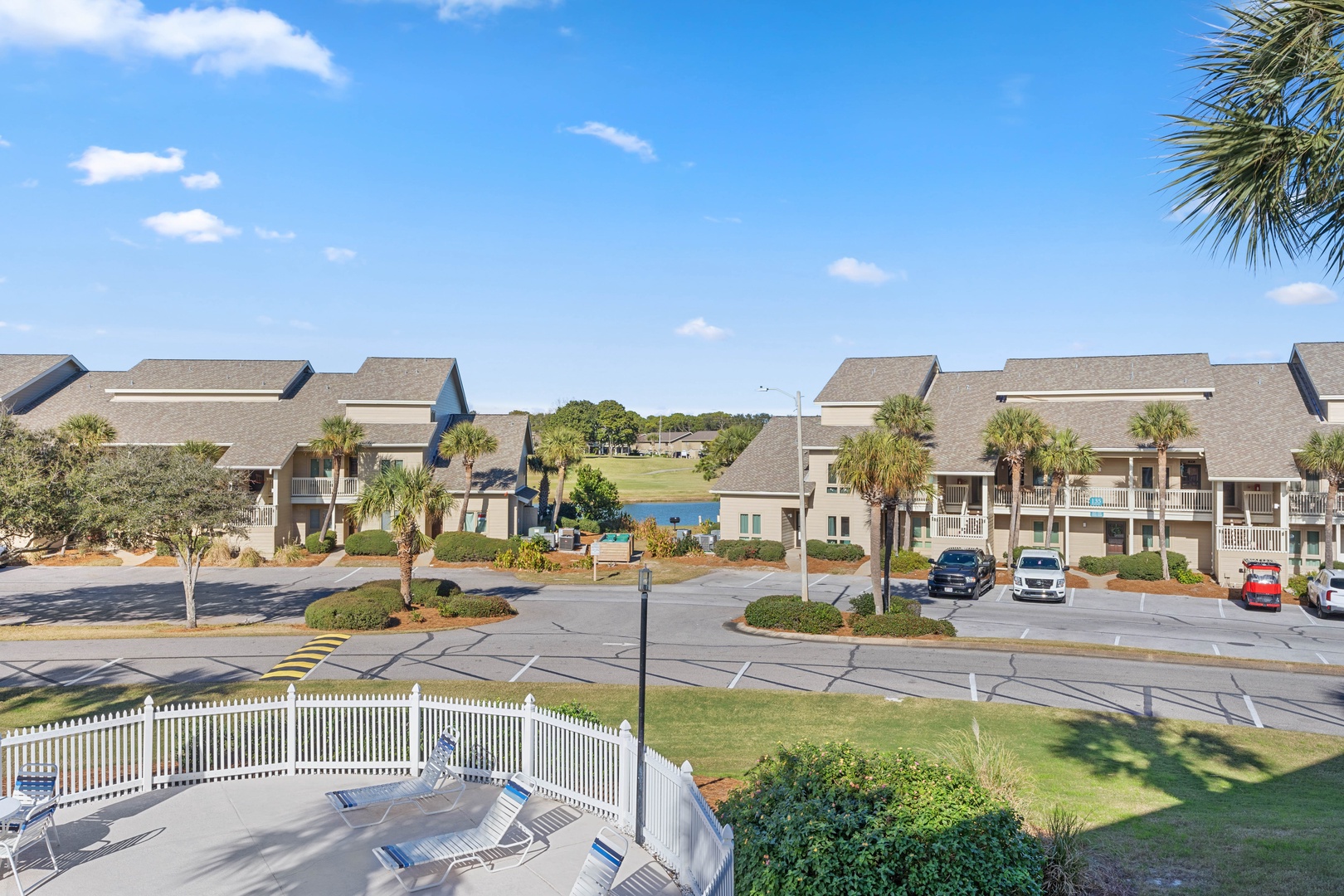 Resort complex with multiple buildings, landscaped grounds, and recreational amenities including a pool area.