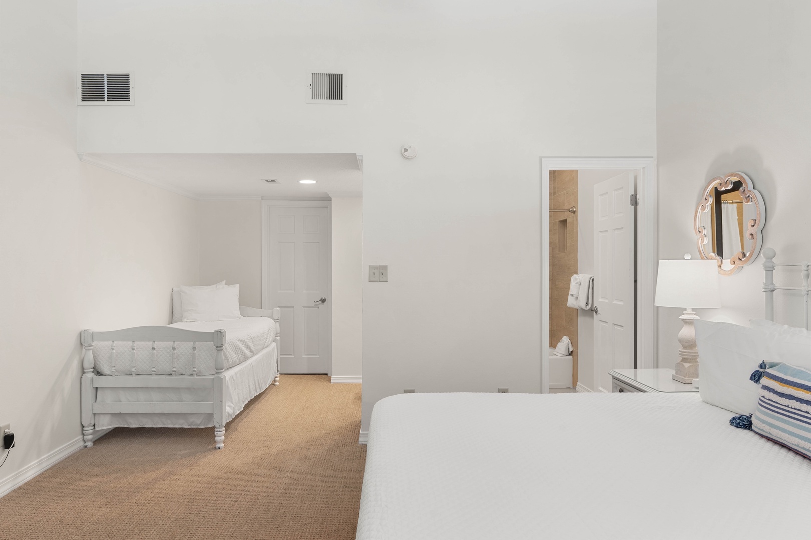 Settle into your peaceful bedroom suite with a cozy crib for little ones and elegant vanity area—comfort meets convenience.