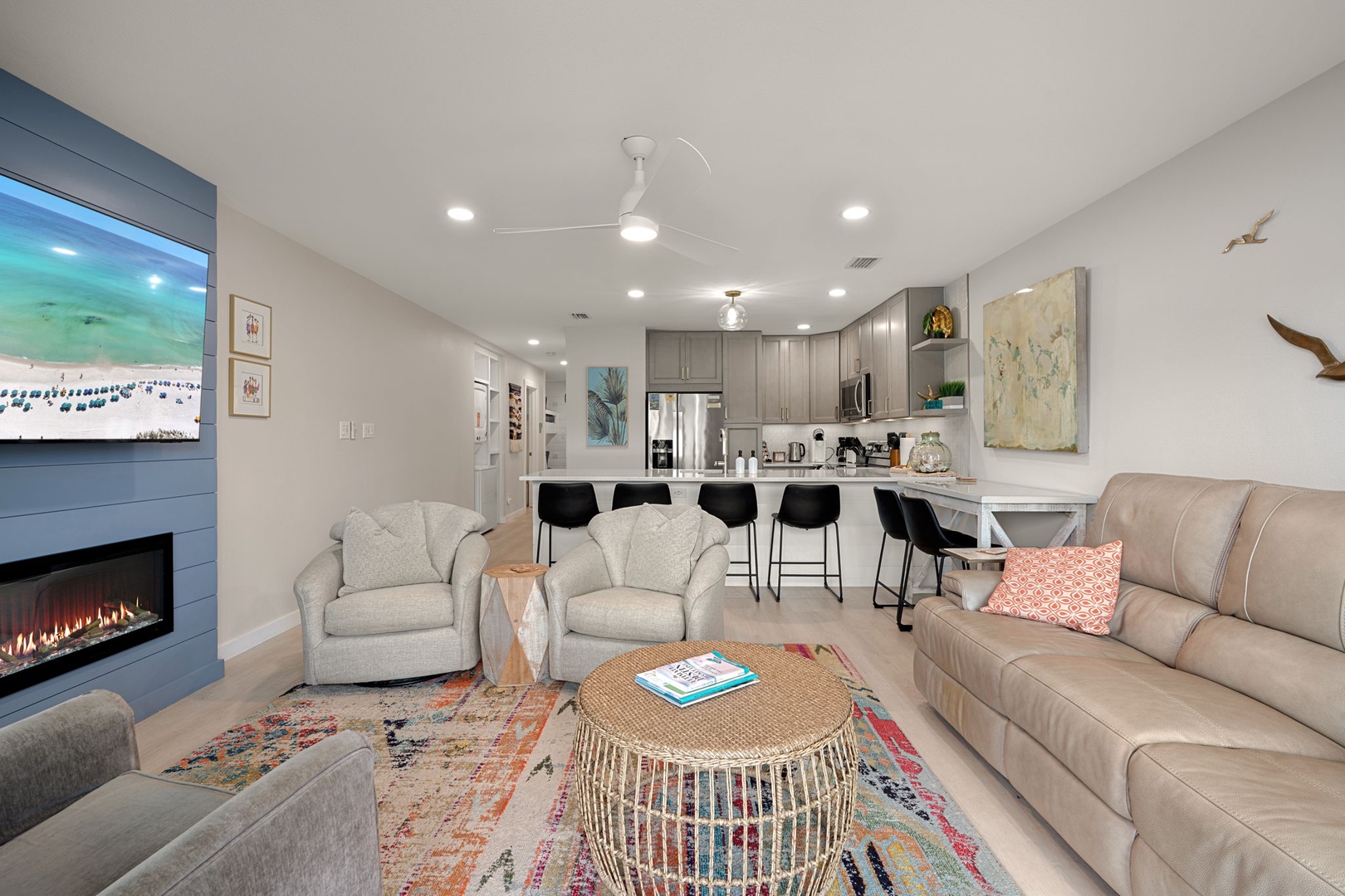 Unwind in your stylish open-concept retreat with cozy fireplace, modern kitchen, and coastal touches throughout this beautifully appointed space.