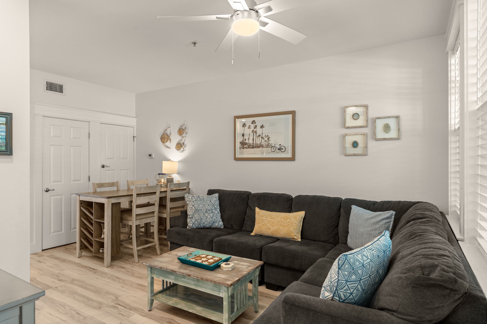 Unwind on the plush sectional after a day of adventure. Your open living space invites easy conversation, with coastal-inspired décor and natural light creating a breezy, welcoming vibe.