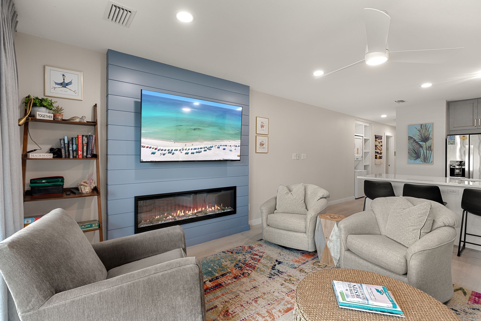 Cozy up by your fireplace while enjoying the big-screen TV and beach views, creating the perfect atmosphere for relaxation.
