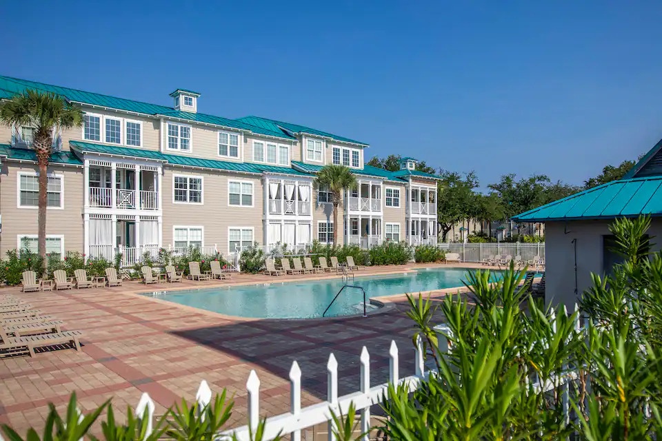 Relax at the inviting community pool surrounded by coastal-inspired architecture and sunny skies. Perfect for cooling off after the beach or enjoying a peaceful afternoon by the water. A refreshing retreat designed for laid-back vacation living.