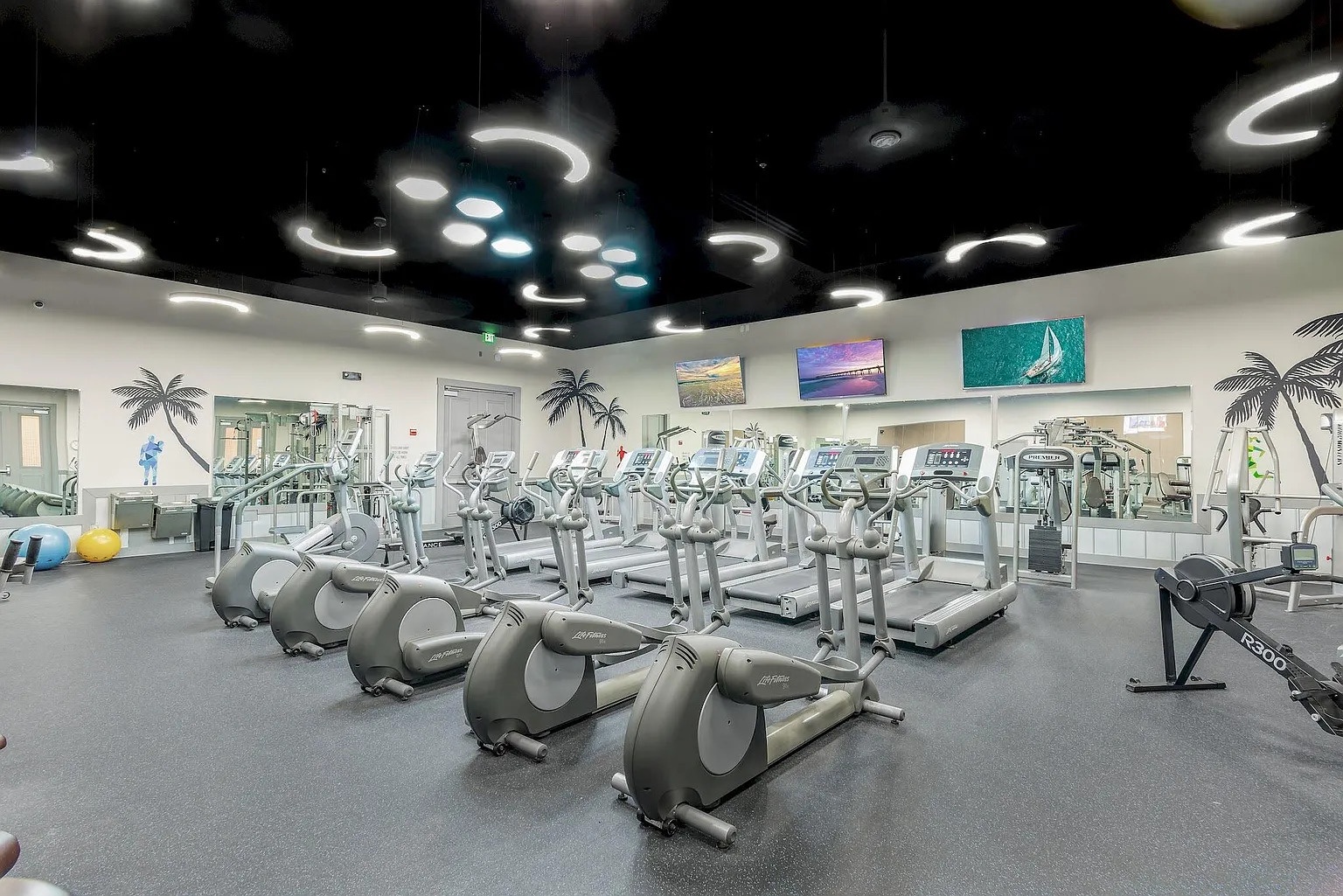 Stay active in your fully-equipped fitness center with cardio machines, weights, and tropical décor to keep you motivated.