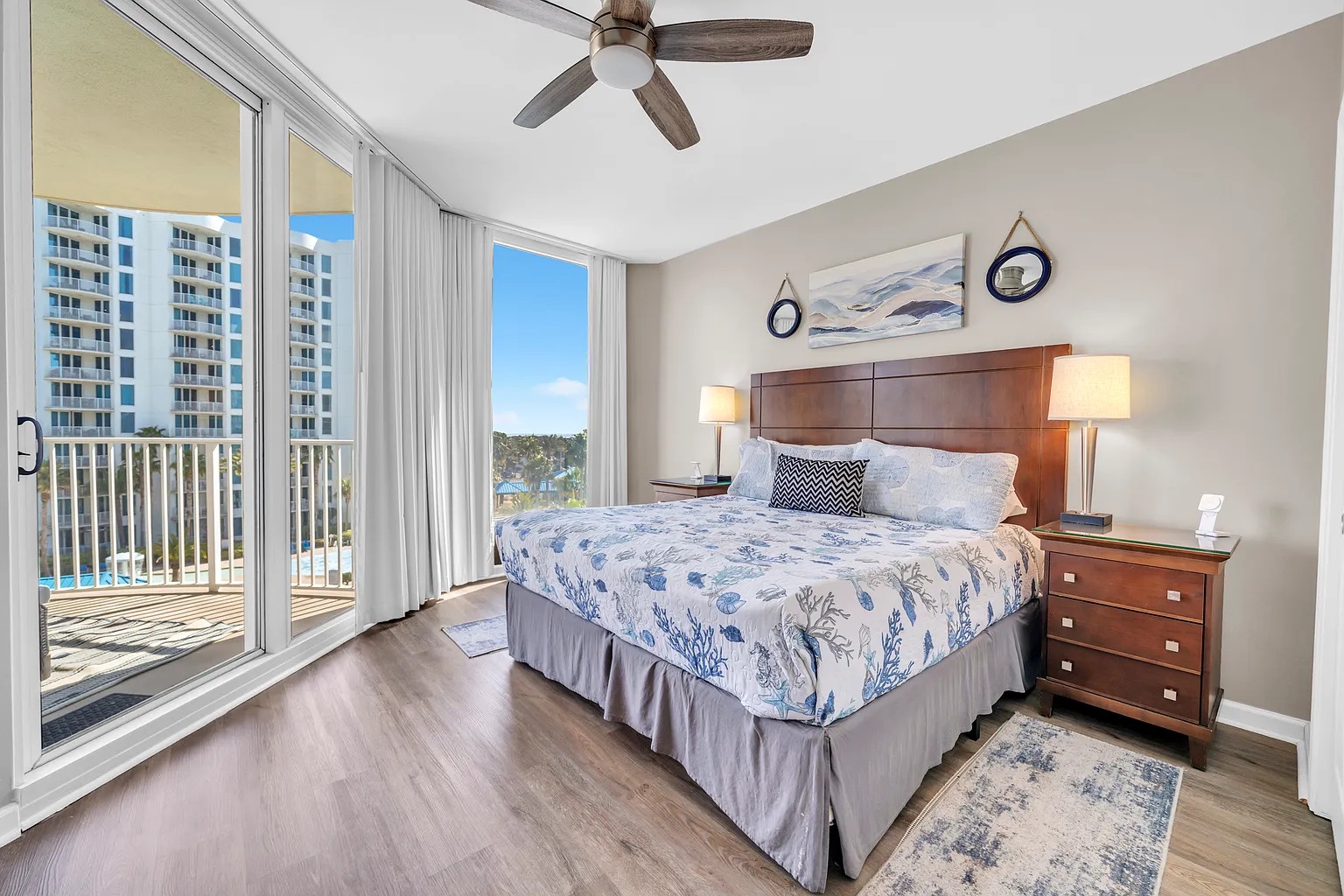 Wake up to stunning city views from your comfortable bedroom, where morning light streams through floor-to-ceiling windows.