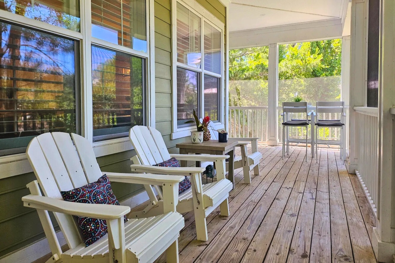 Stretch out and savor the slow pace on this inviting screened porch. Comfy seating, fresh air, and a tranquil setting make it a perfect place to relax anytime of day.