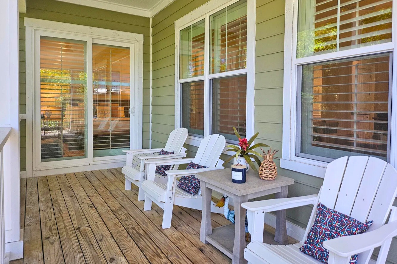 Relax on the back porch with comfortable seating and coastal charm—perfect for morning coffee, evening conversations, and soaking in the laid-back Florida atmosphere.
