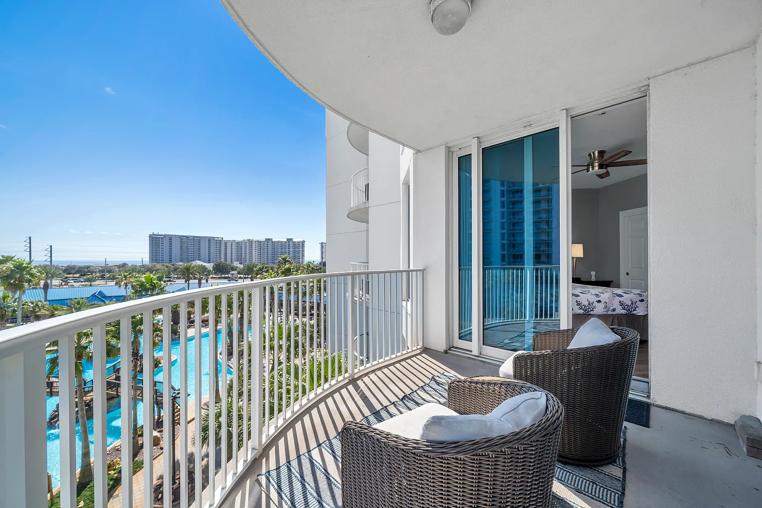Step onto your private balcony where two plush wicker chairs await your morning coffee or evening relaxation.