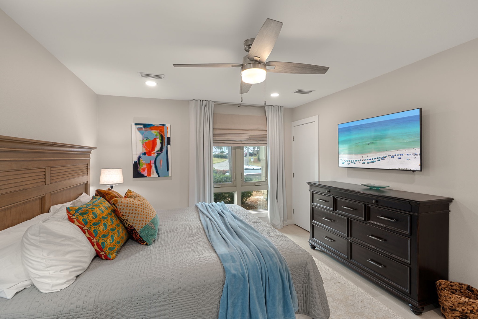 Rest peacefully in your coastal-inspired bedroom with plush linens, modern amenities, and a tranquil atmosphere perfect for vacation dreams.