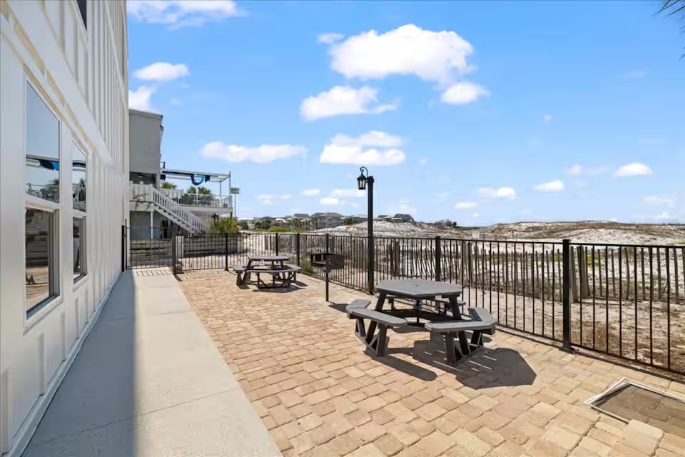 Beachside picnic and grilling area with Gulf views—perfect for outdoor meals and relaxing by the shore.