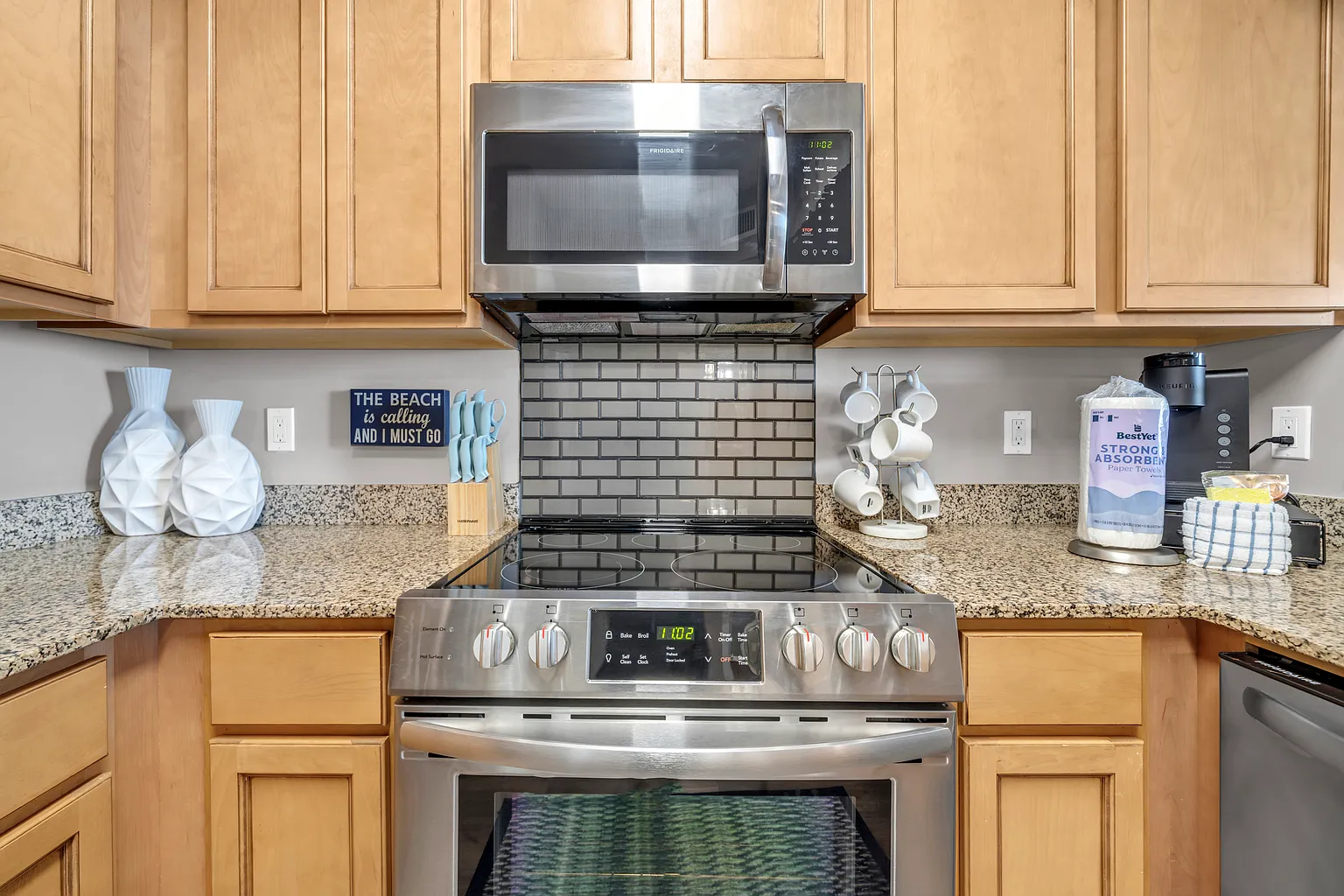 Your fully equipped kitchen awaits with granite counters, stainless appliances, and charming coastal touches for memorable meal preparation.
