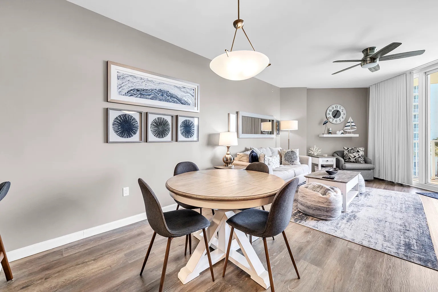 Unwind in this stylish open-concept space where elegant dining meets coastal comfort, creating your perfect home base.