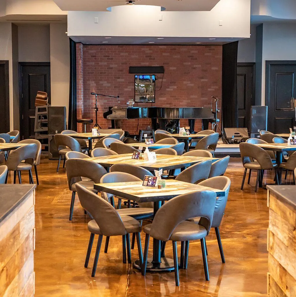 Gather with friends in this stylish dining space, where live music meets comfortable seating for memorable evenings together.