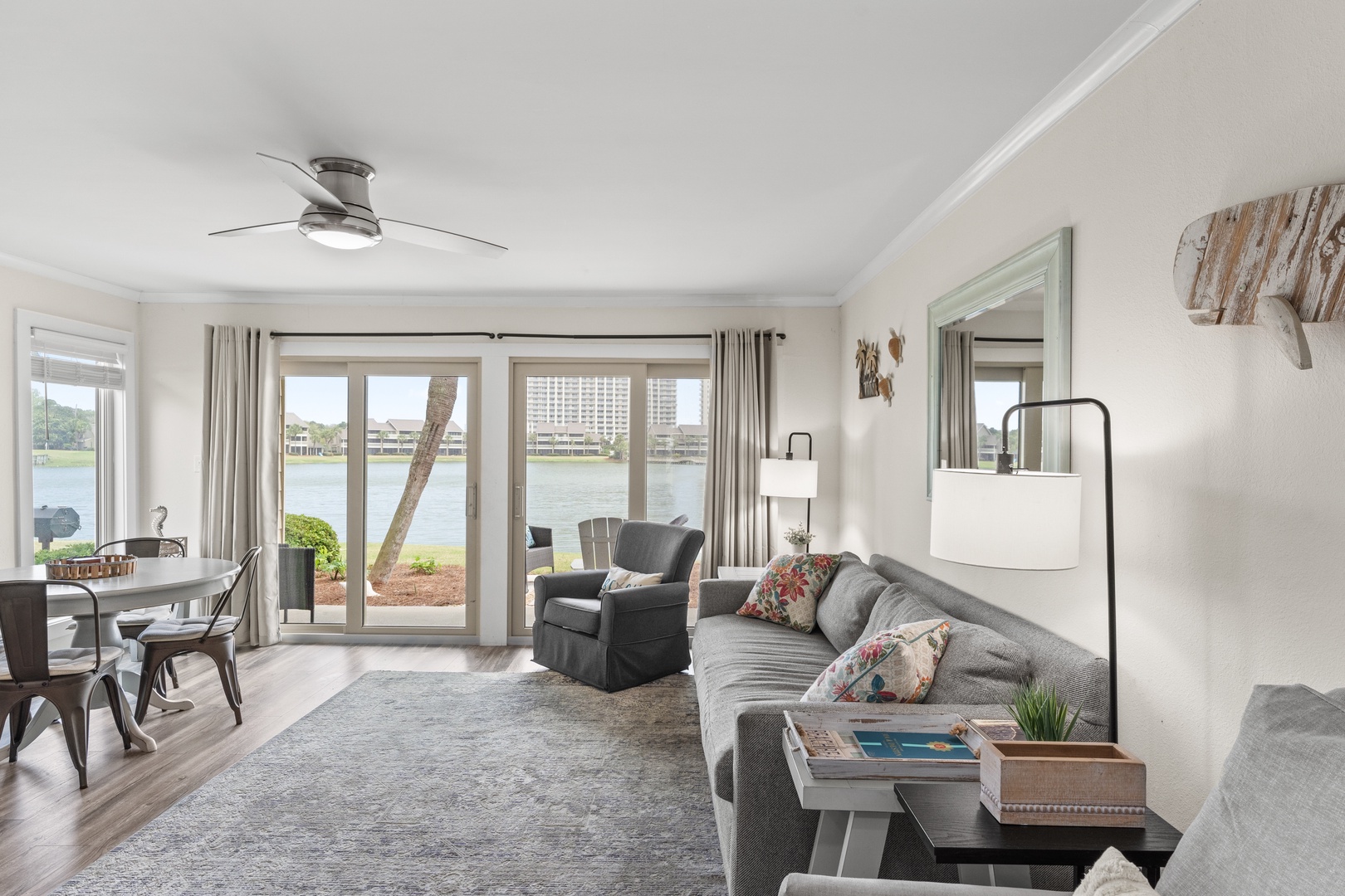 Unwind in your spacious waterfront living room with stunning lake views through floor-to-ceiling windows.