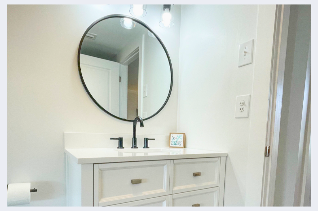 Your bright bathroom vanity offers clean lines and ample storage for your morning routine.