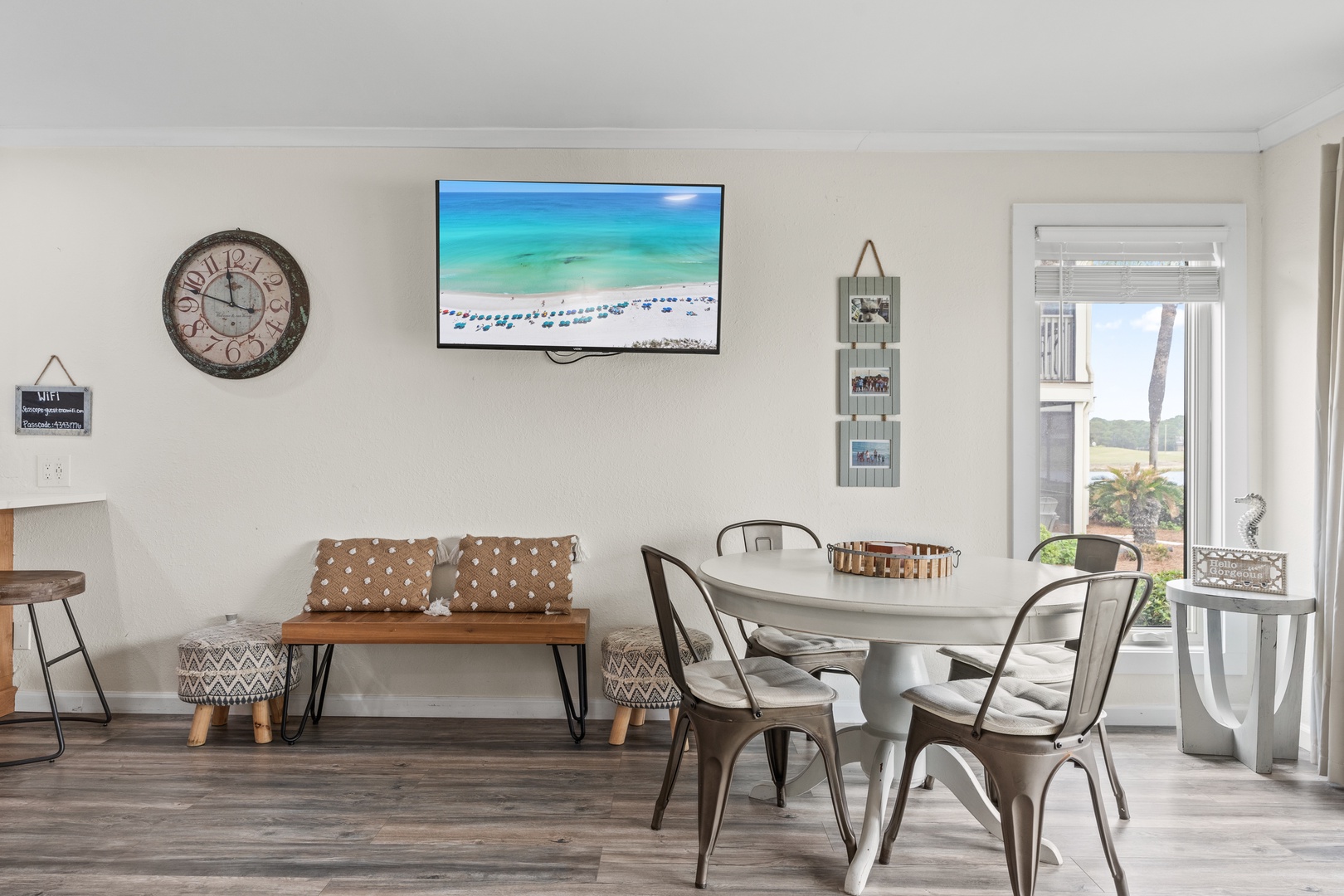 Gather around your stylish dining table while enjoying the large TV and beautiful natural light streaming through your windows.