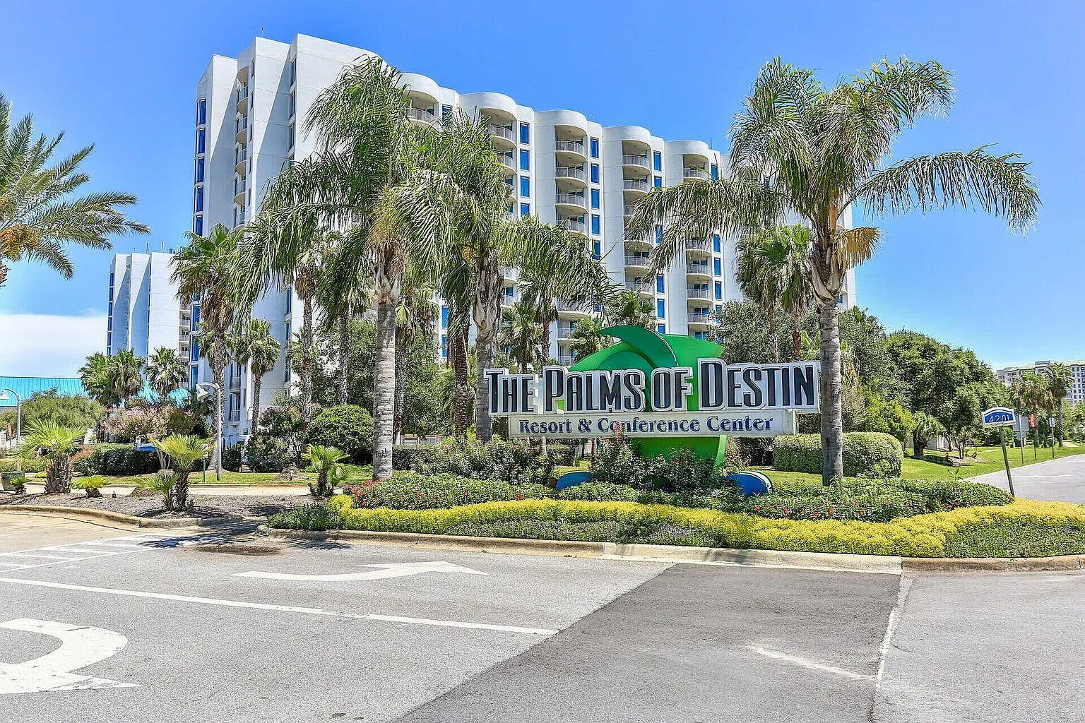 The Palms of Destin Resort & Conference Center welcomes guests with tropical landscaping and modern accommodations.