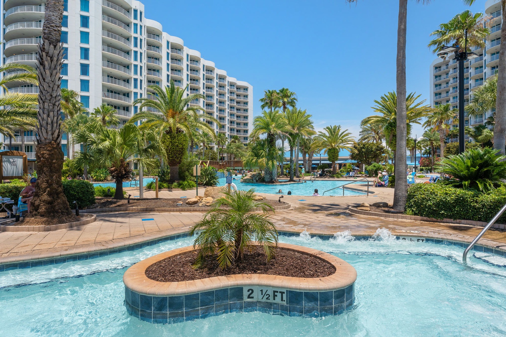 This beachfront resort features a tropical pool oasis with lush palm trees, sparkling pools, and ocean views—perfect for soaking up the sun in paradise.