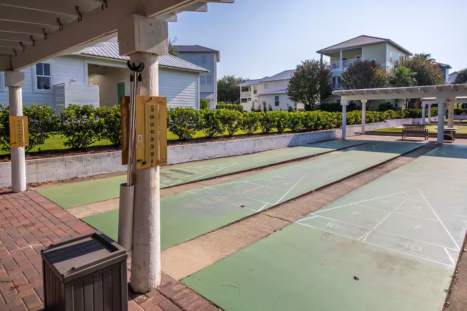 Challenge friends and family to a game at the community shuffleboard courts. A fun outdoor amenity perfect for relaxing afternoons in the coastal sunshine. Great for enjoying laid-back vacation moments and friendly competition.