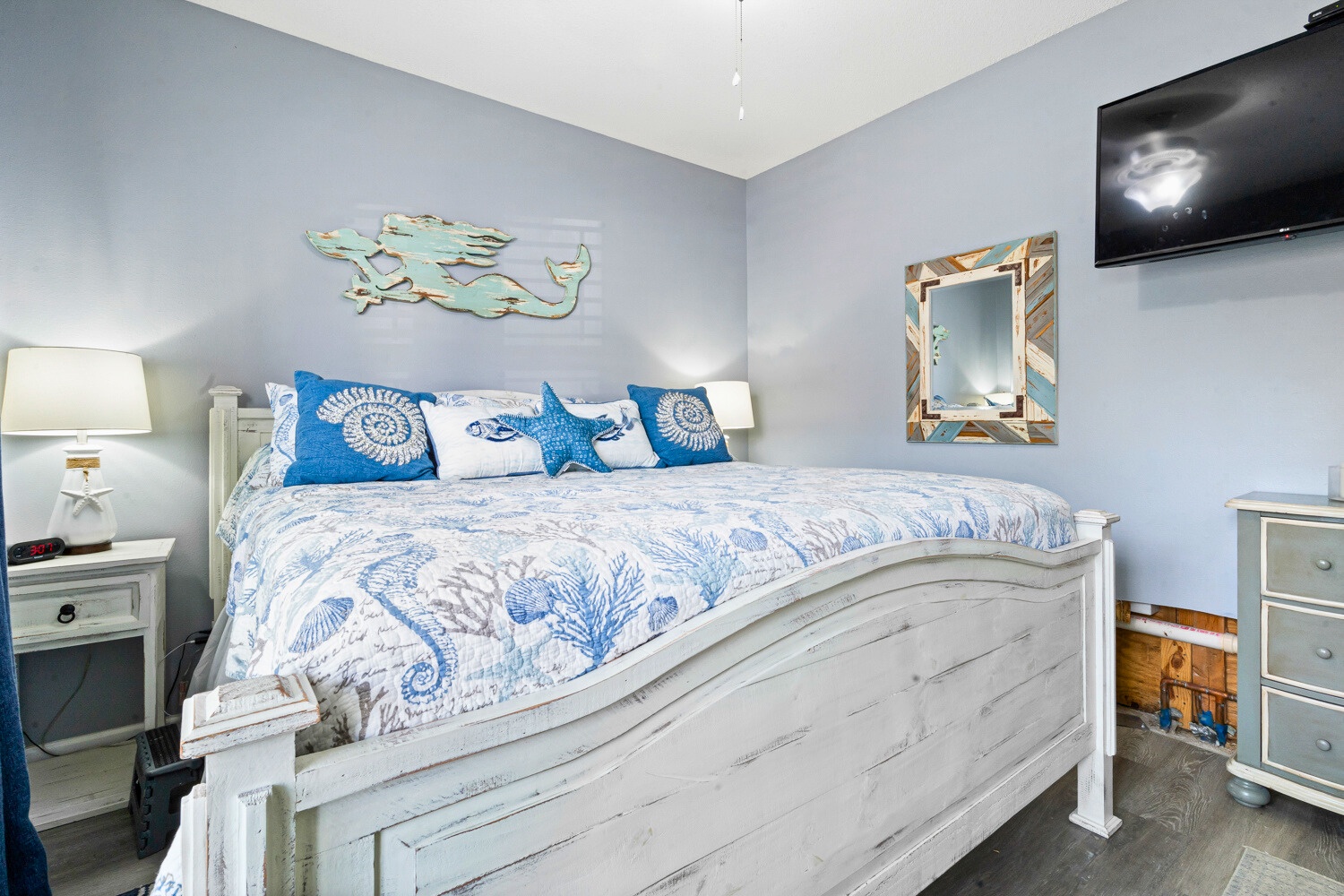 Drift into dreams in your coastal-themed bedroom with ocean-inspired decor and modern amenities.