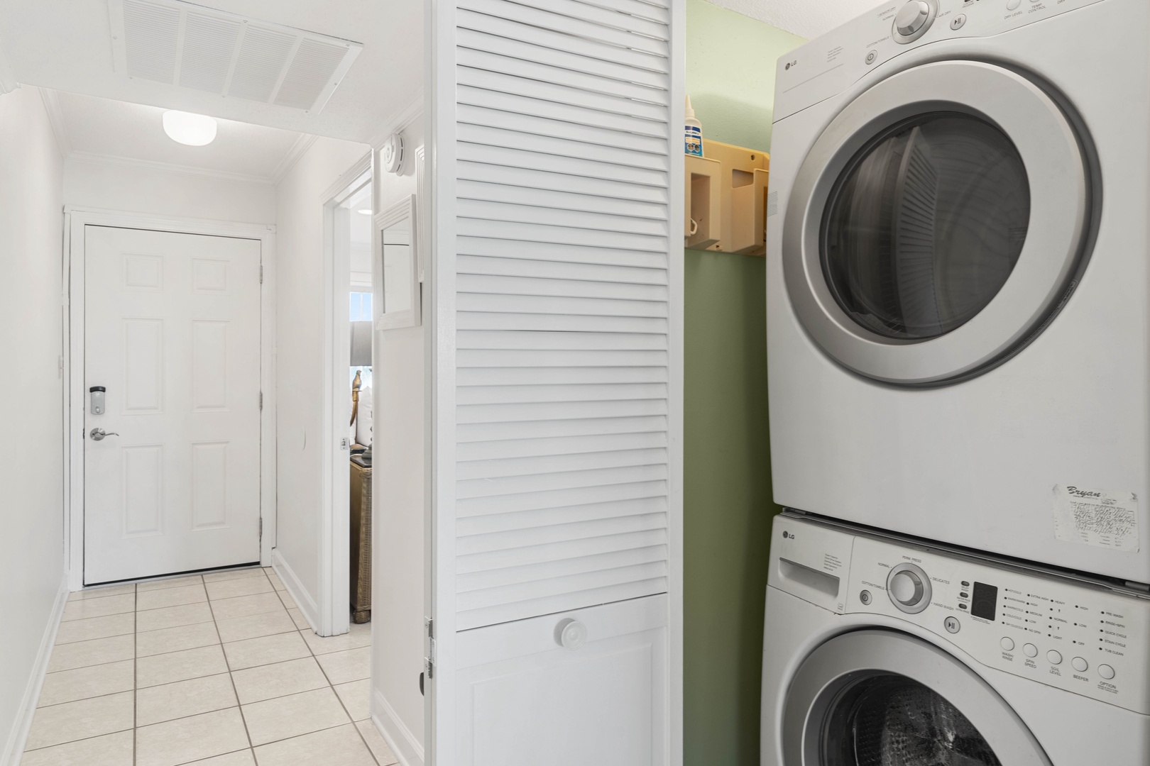 Your convenient in-unit laundry closet keeps fresh clothes just steps away, tucked neatly behind stylish louvered doors for seamless living.