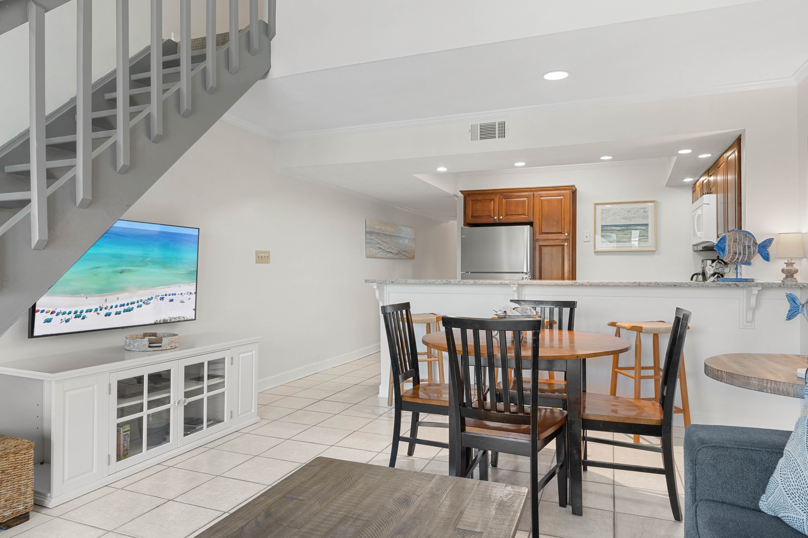 Relax in your bright, open-concept living space with a fully equipped kitchen and cozy dining area perfect for memorable meals.