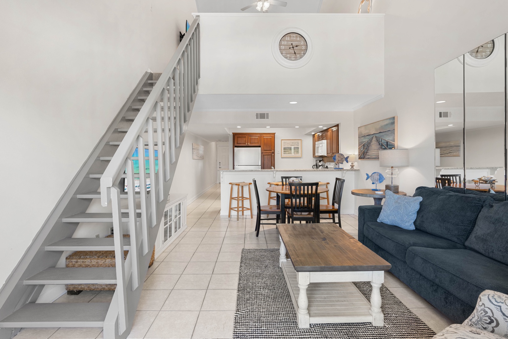 Your open-concept retreat seamlessly blends coastal charm with modern comfort, where you can cook, dine, and relax in one beautiful space.