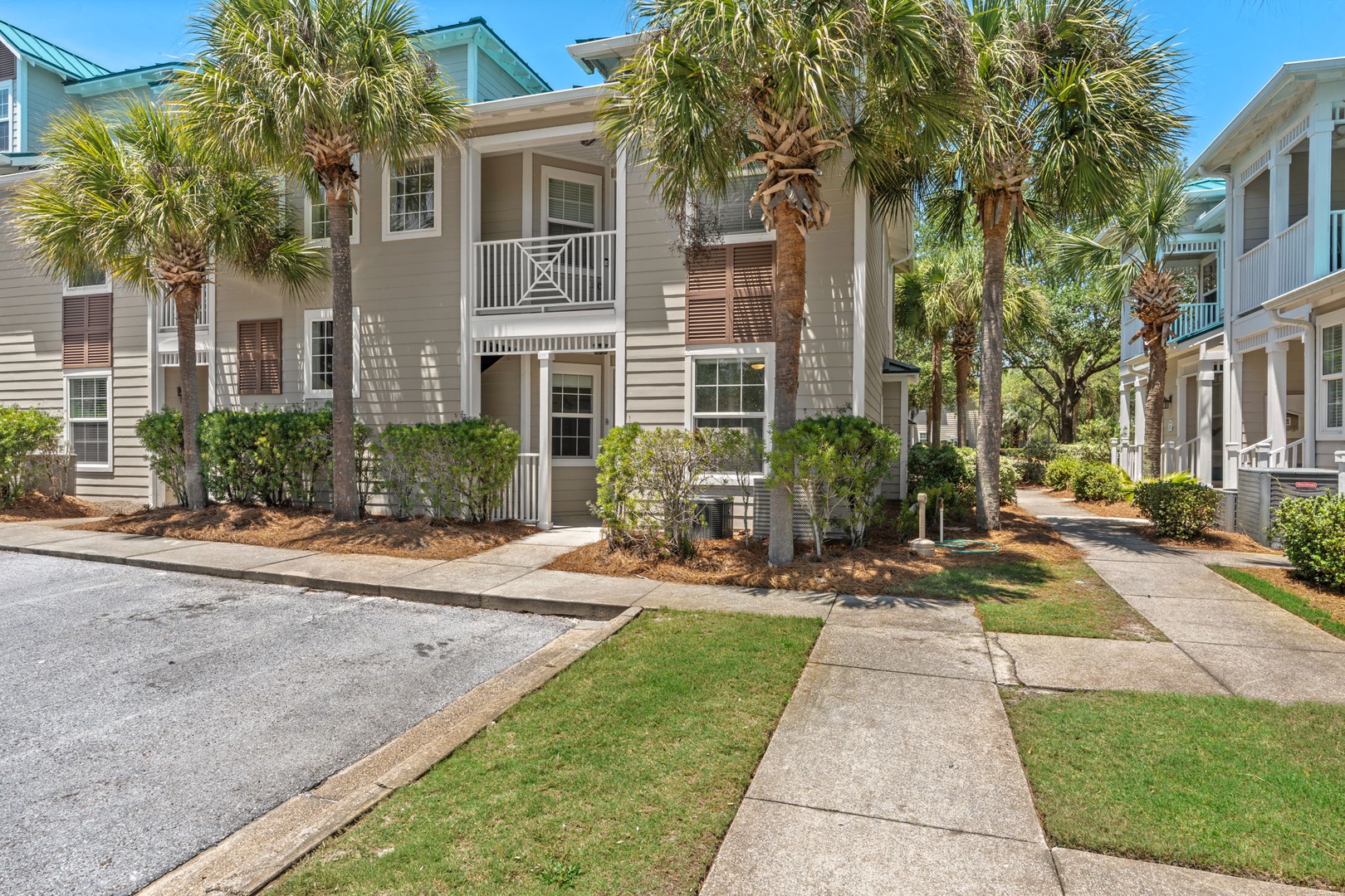 Beachside retreat nestled among palm trees, with classic coastal architecture and peaceful pathways leading to your door.