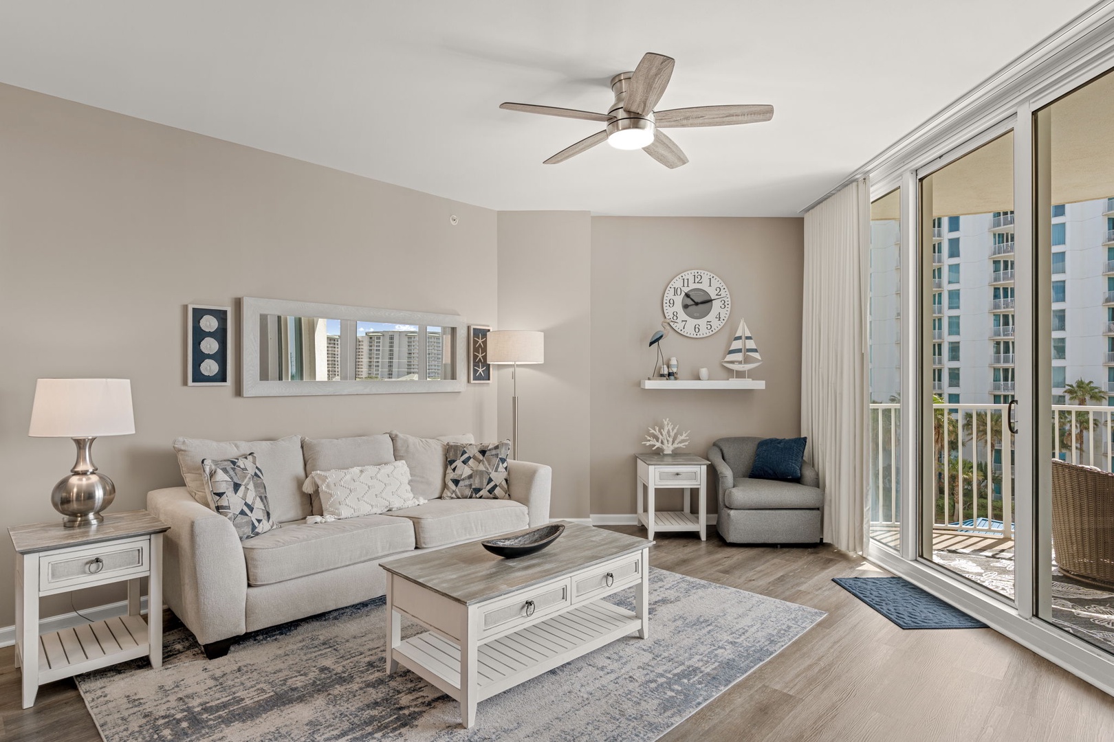 Sink into this serene coastal retreat with soft neutrals and breezy comfort. Step through sliding doors to your private balcony overlooking lush palms and city views.