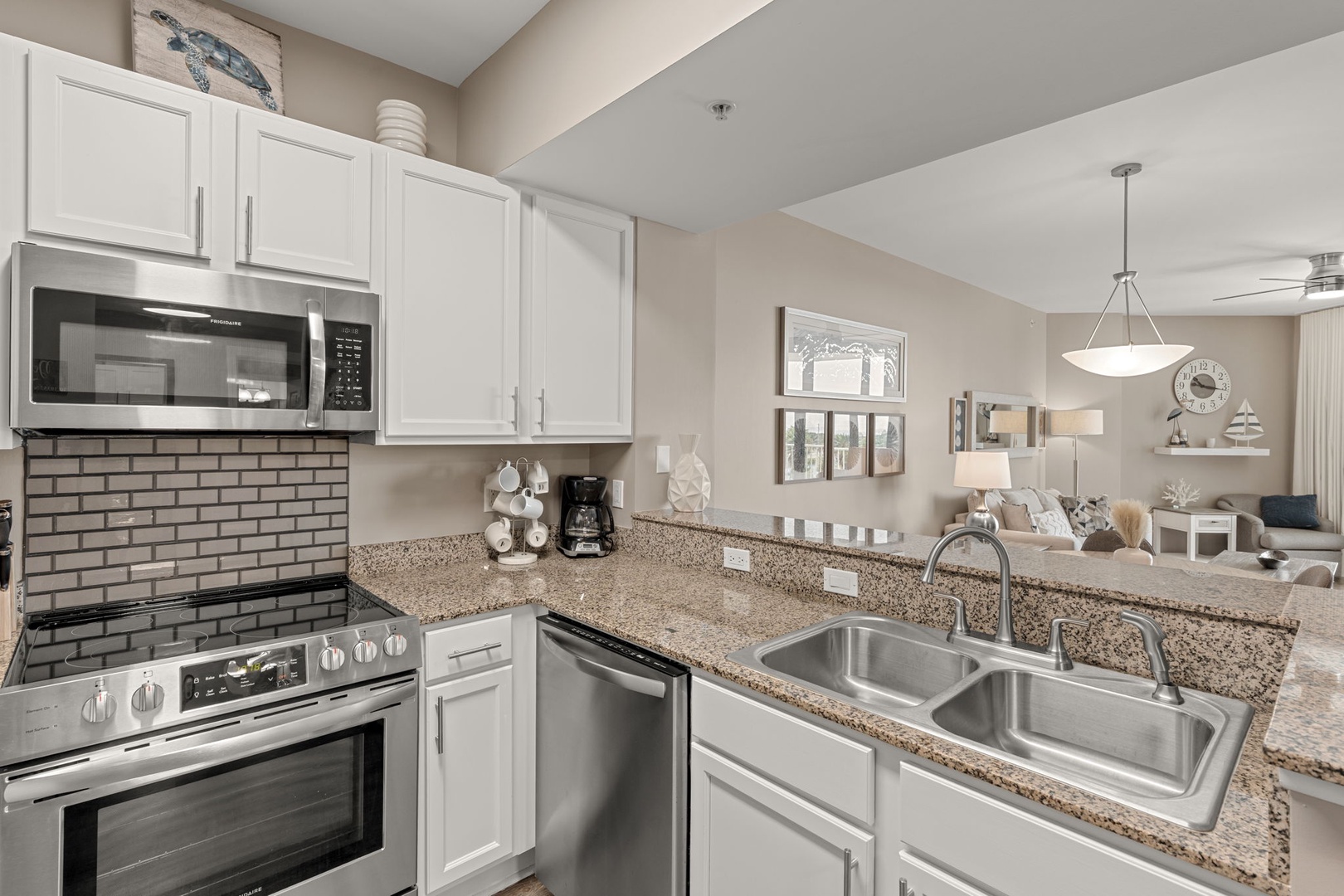 Step into your fully equipped kitchen with granite counters, stainless appliances, and modern style—complete with coffee maker for leisurely mornings.