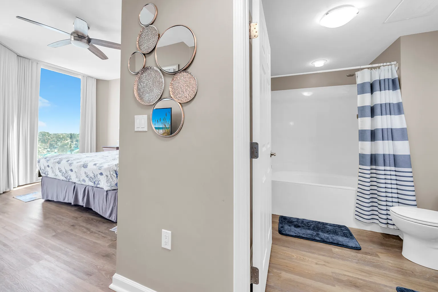 Step into your bright bedroom with stylish decor and enjoy the convenience of your private bathroom just steps away.