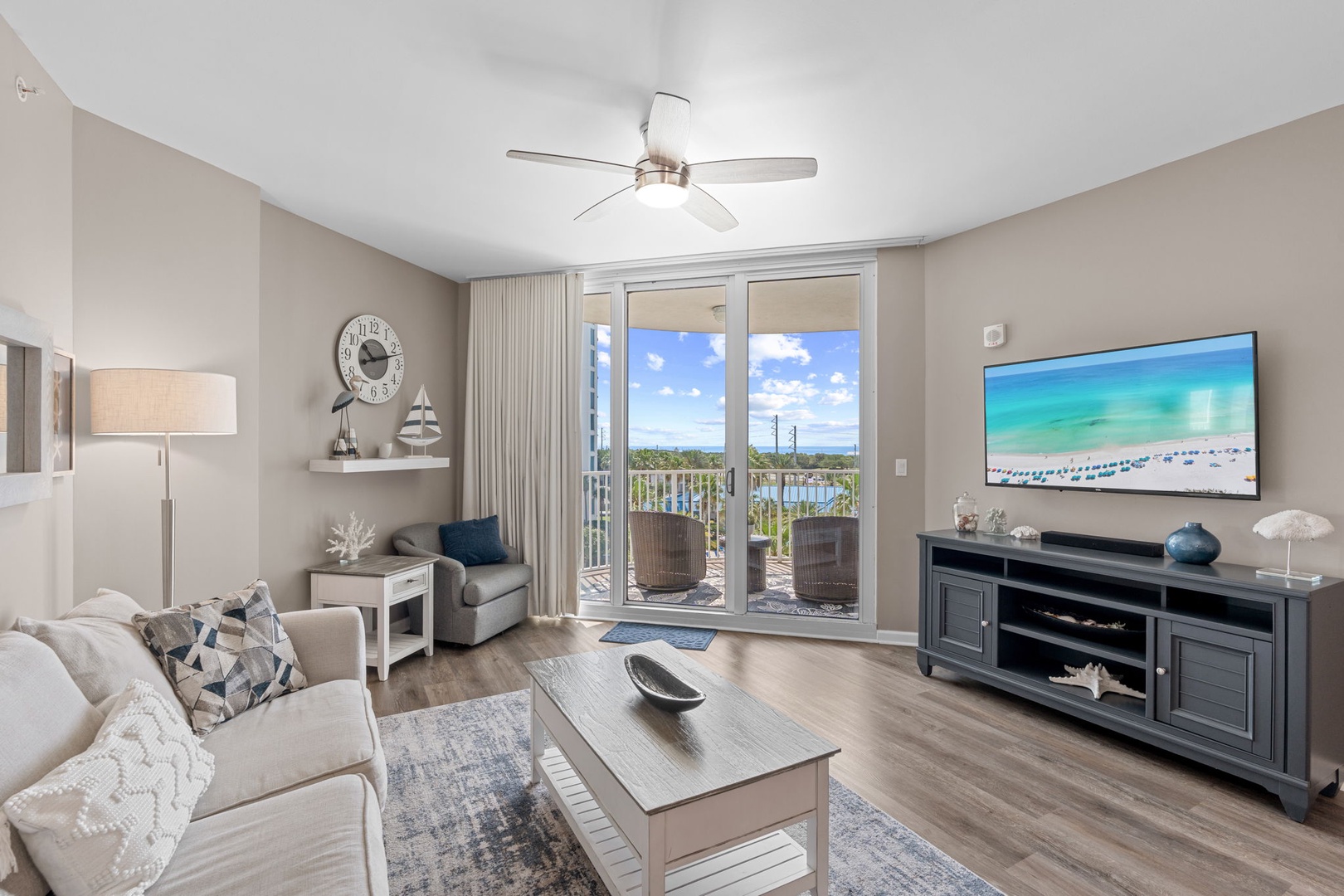 Your bright, coastal-themed living space opens to a private balcony, where you can unwind with ocean breezes and enjoy serene views of the surrounding landscape.