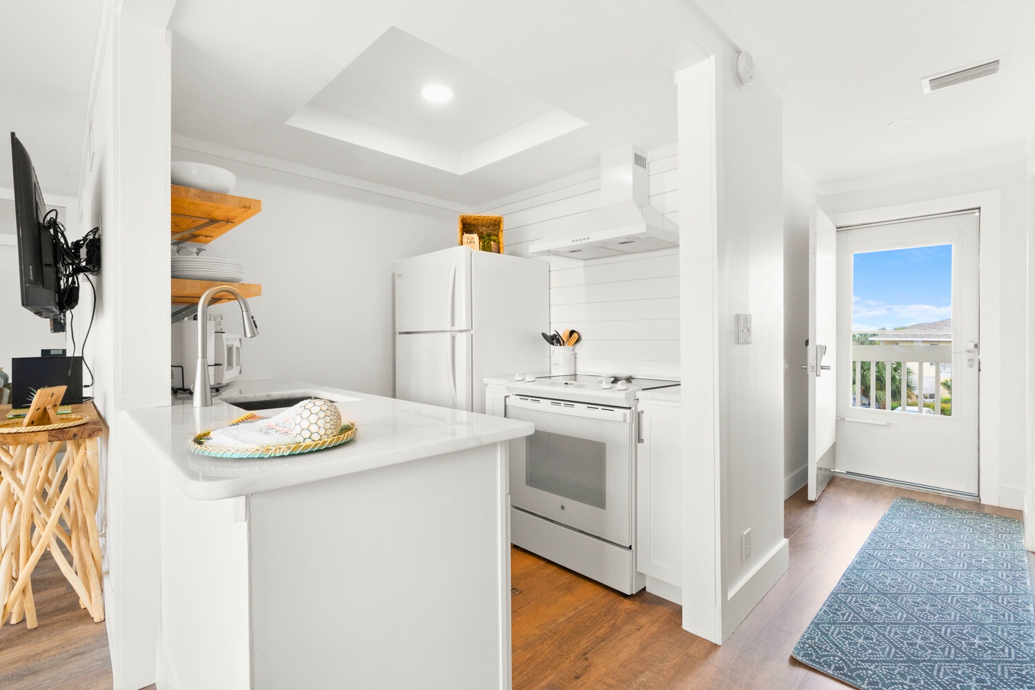 Your bright kitchen awaits with modern appliances and sleek countertops, perfect for preparing meals while enjoying the open-concept flow.