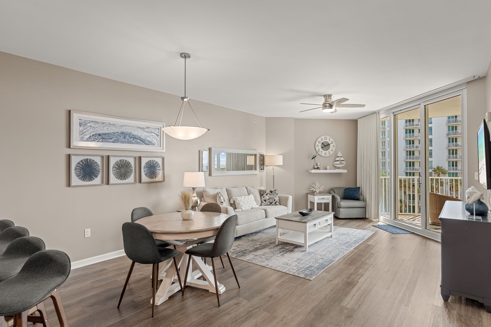 Step into your bright, open living space where modern comfort meets coastal charm. Relax on plush seating, dine at the stylish table, and unwind on your private balcony with views of the surroundings.