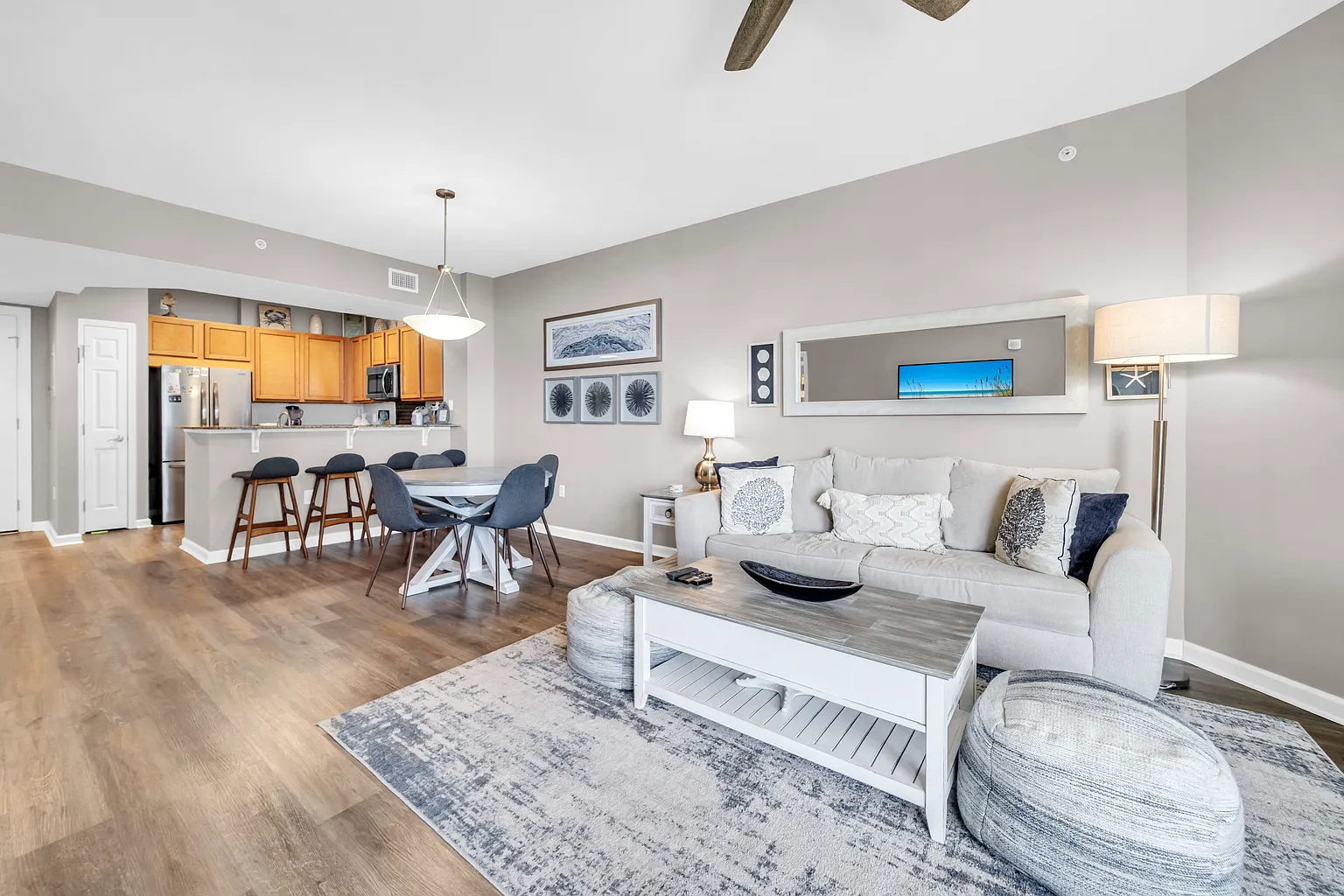 Your spacious open-plan living area flows seamlessly from kitchen to lounge, where you'll unwind on plush seating under rustic beams.