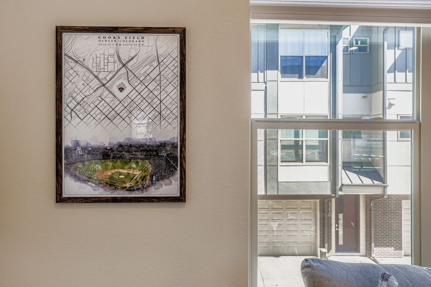 Relax by your window with a view of the quiet neighborhood while appreciating the local baseball history displayed on your wall.