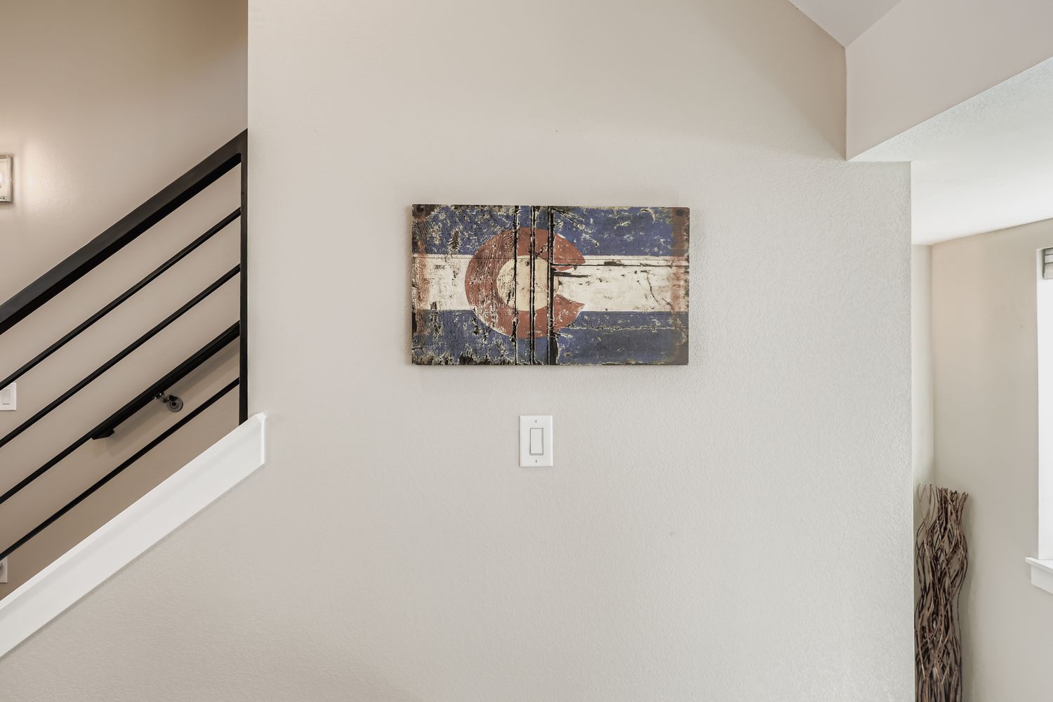 Modern staircase with artistic touches creates a welcoming atmosphere as you arrive at your stylish retreat.