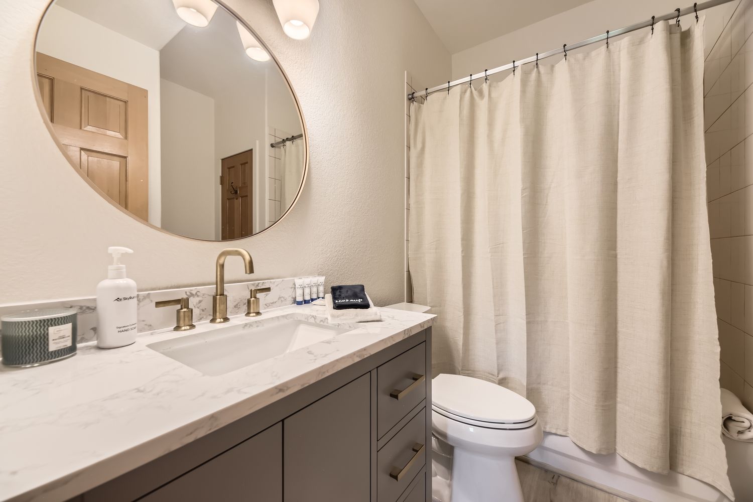 Your private bathroom features marble countertops, premium fixtures, and a refreshing shower to start or end your day perfectly.