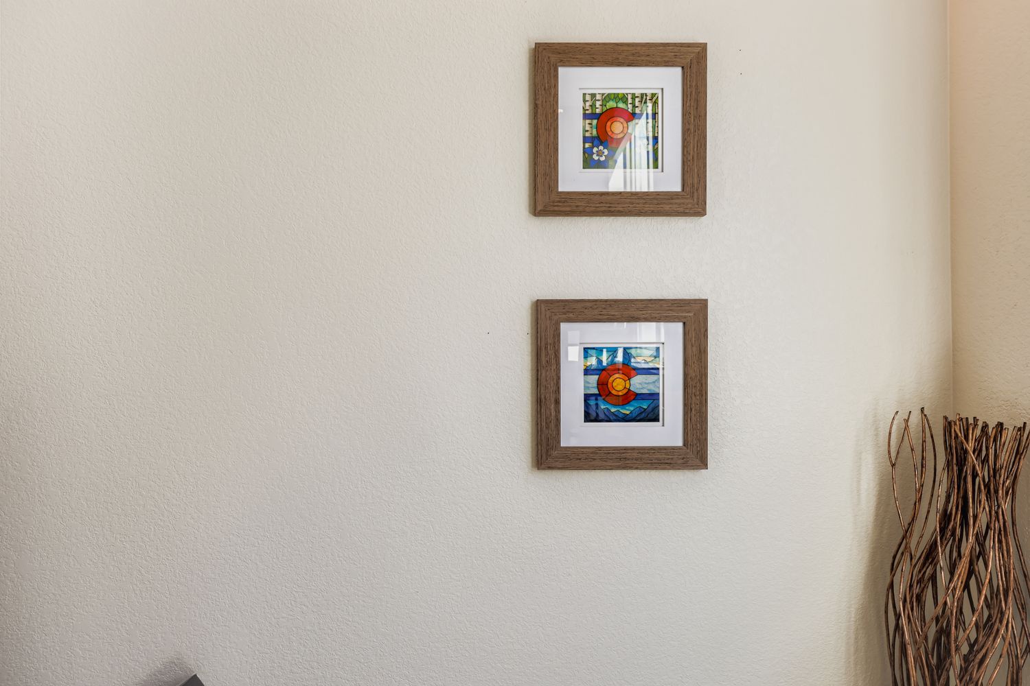 Thoughtful artwork adorns your wall, creating a welcoming atmosphere with warm wooden frames and colorful prints that make your space feel like home.