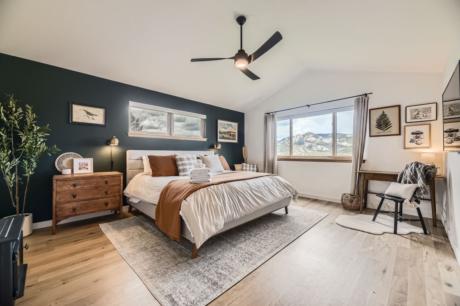 Rest peacefully in this beautifully designed bedroom, where mountain views and modern comforts create your perfect retreat.