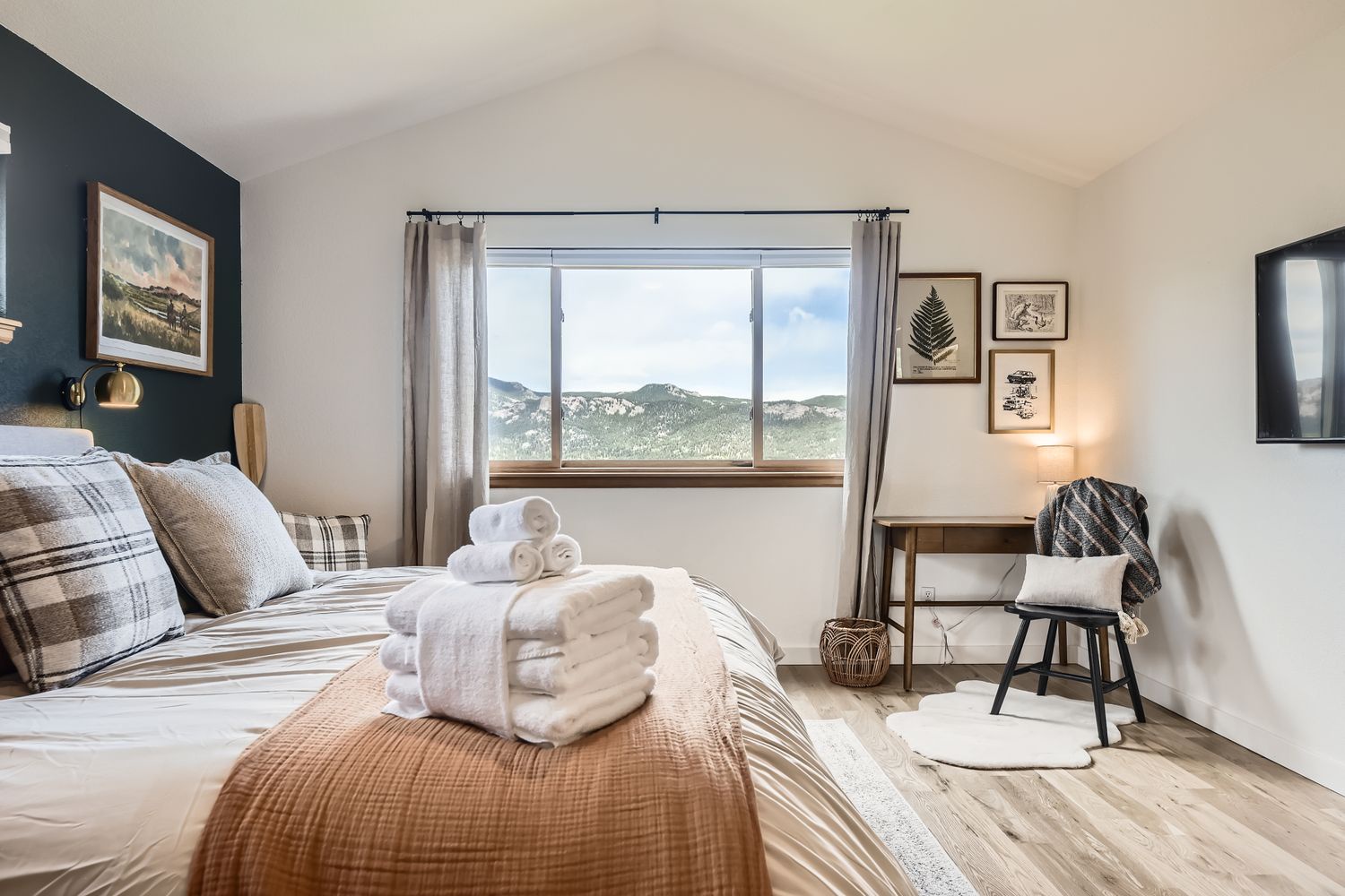Wake up to stunning mountain views from your cozy bedroom, where plush linens and thoughtful touches create your perfect retreat.