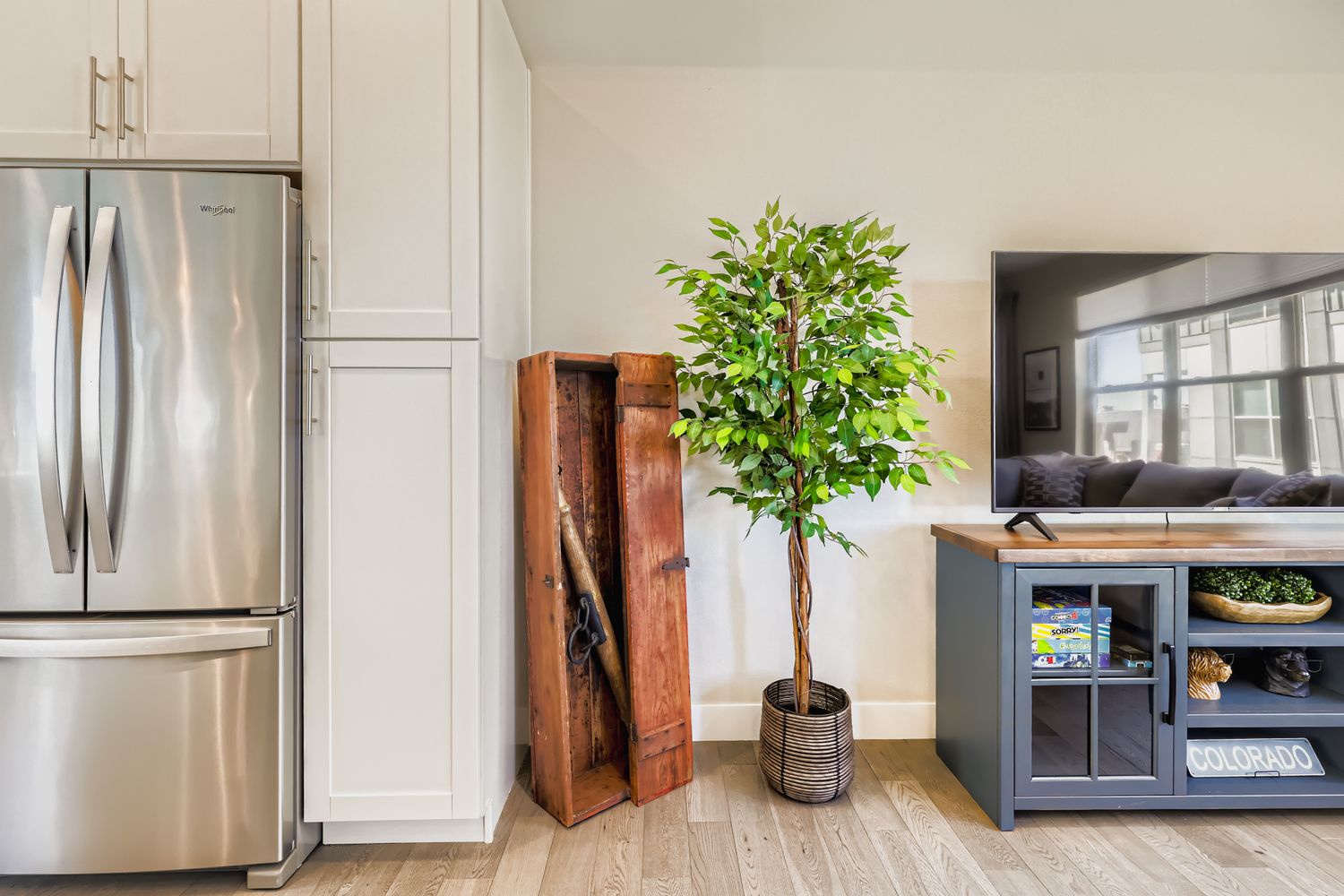 Your fully equipped kitchen features stainless steel appliances and warm wood touches, creating the perfect space for cooking memorable meals.