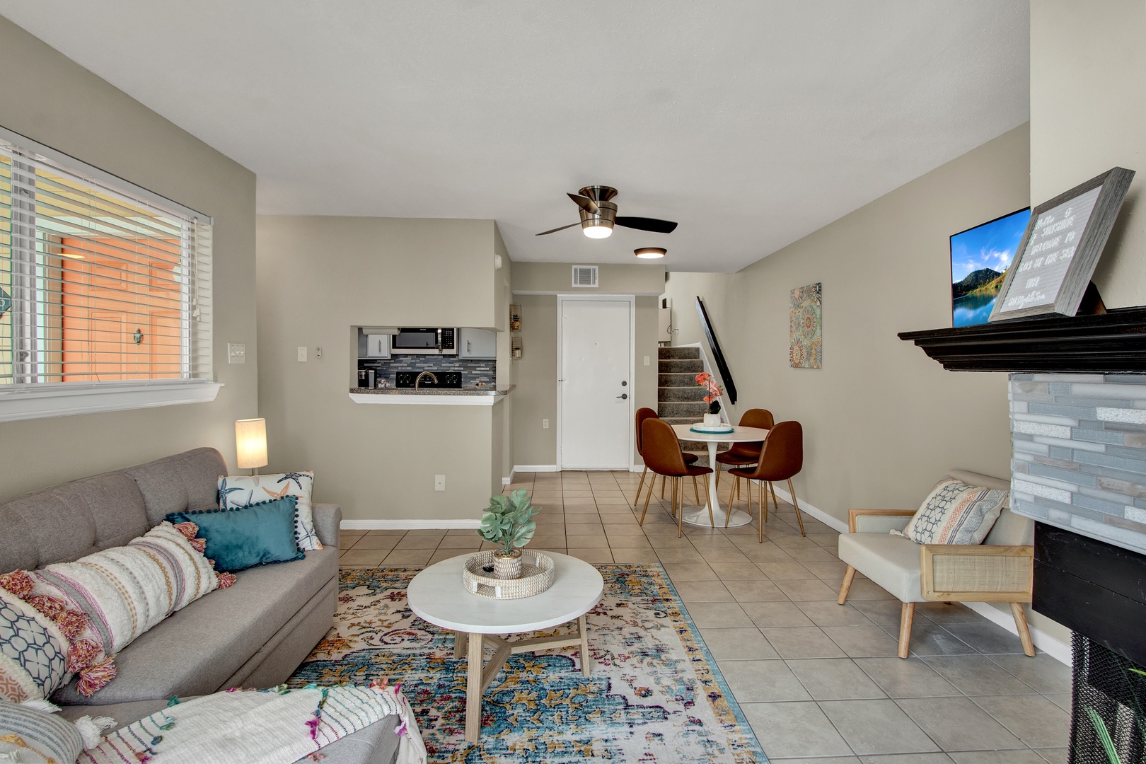 Bright open living space with kitchen and dining.
